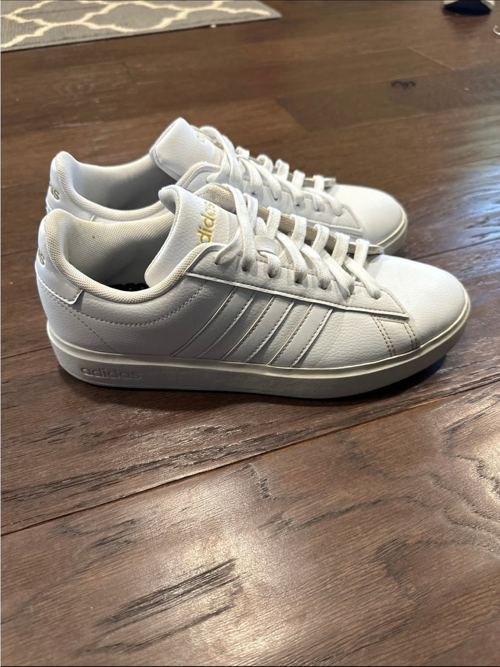 adidas White Low-Top Sneakers with Gold Accents
